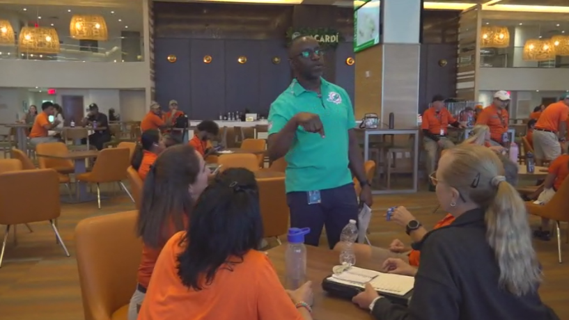 Miami Dade College professor finds his passion with side job at Hard Rock Stadium — CBS Miami, Key Biscayne Arts news